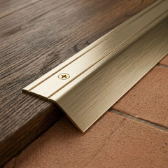 aluminium door threshold bar screw fix anodised gold finish close up image