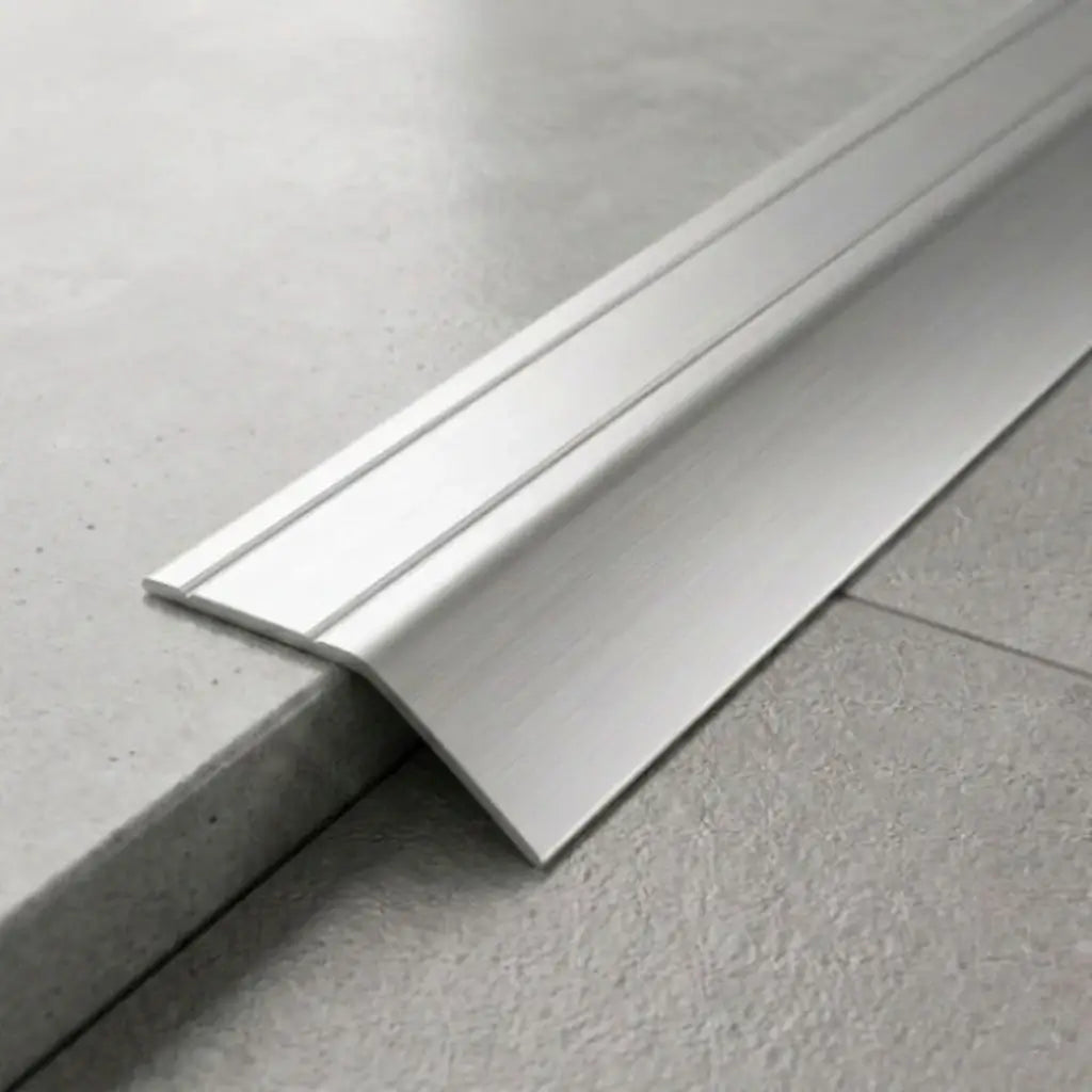 Anodised aluminium self-adhesive door threshold bar close up Silver finish