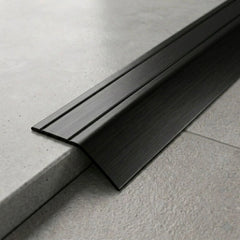Anodised aluminium self-adhesive door threshold bar, close up, Black finish