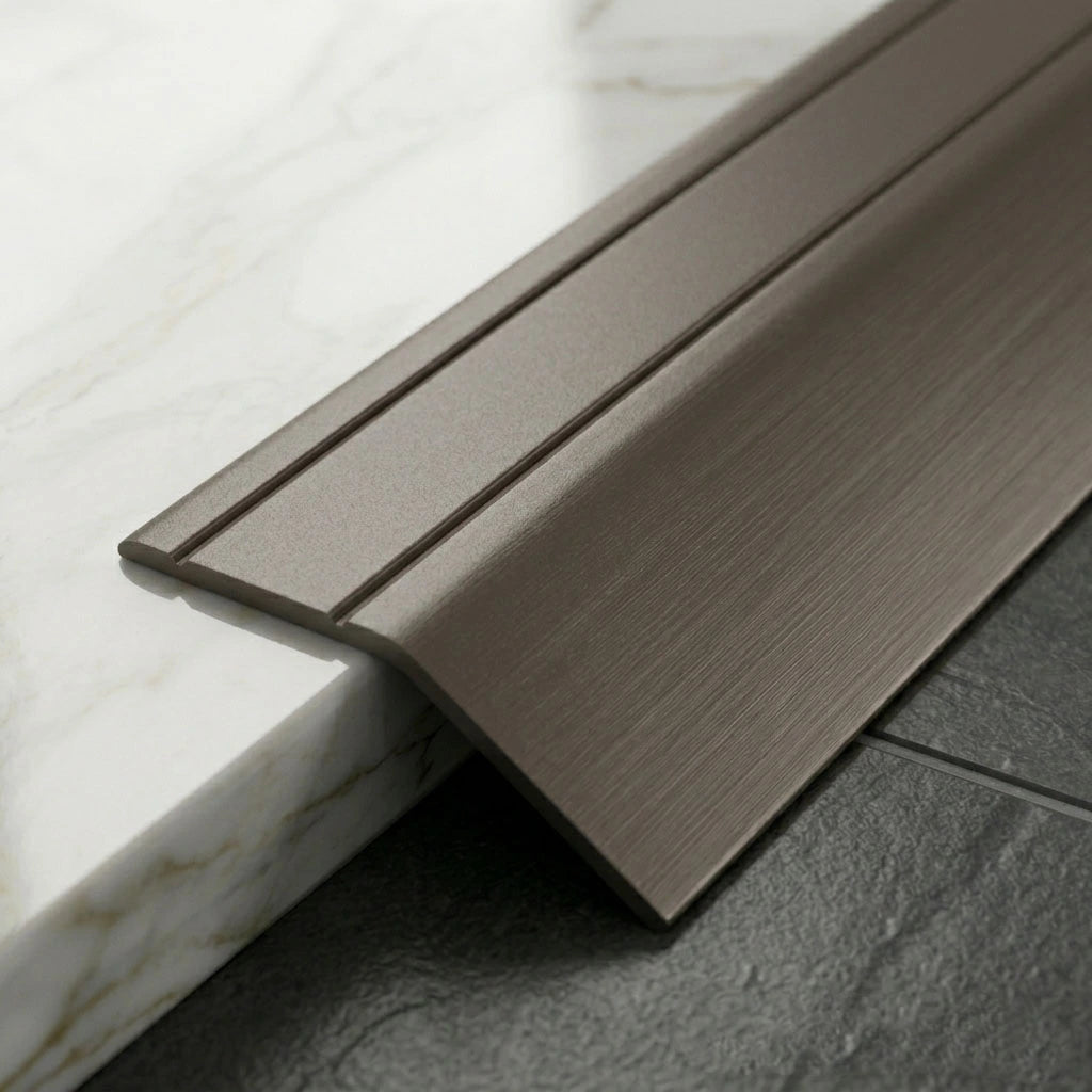 Anodised aluminium self-adhesive door threshold bar close up Champagne finish