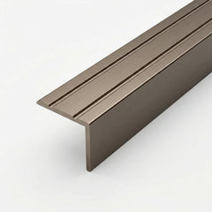 chamoagne brushed aluminum stair nosing profile with anti-slip grooves, shown in close-up on a white background.