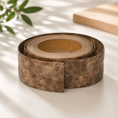 Flexible PVC Skirting Board roll in Corck wood finish, self-adhesive wall base molding for floor edging and corner protection.