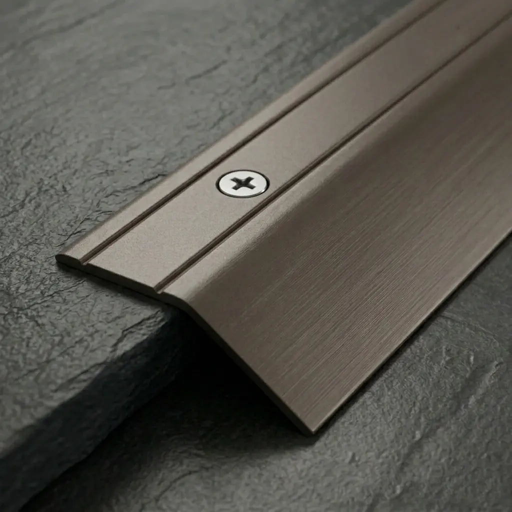 Aluminium door threshold bar screw fix anodised champagne finish close up image