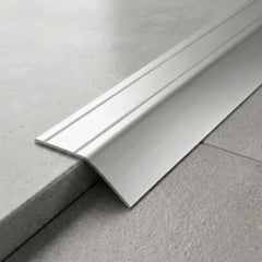 Anodised aluminium self-adhesive door threshold bar close up  Silver finish