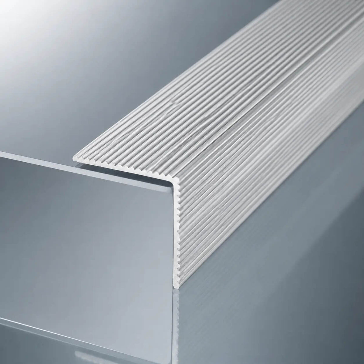 Silver anodised aluminium anti-slip stair nosing 35x35mm self-adhesive ribbed edge trim for stairs