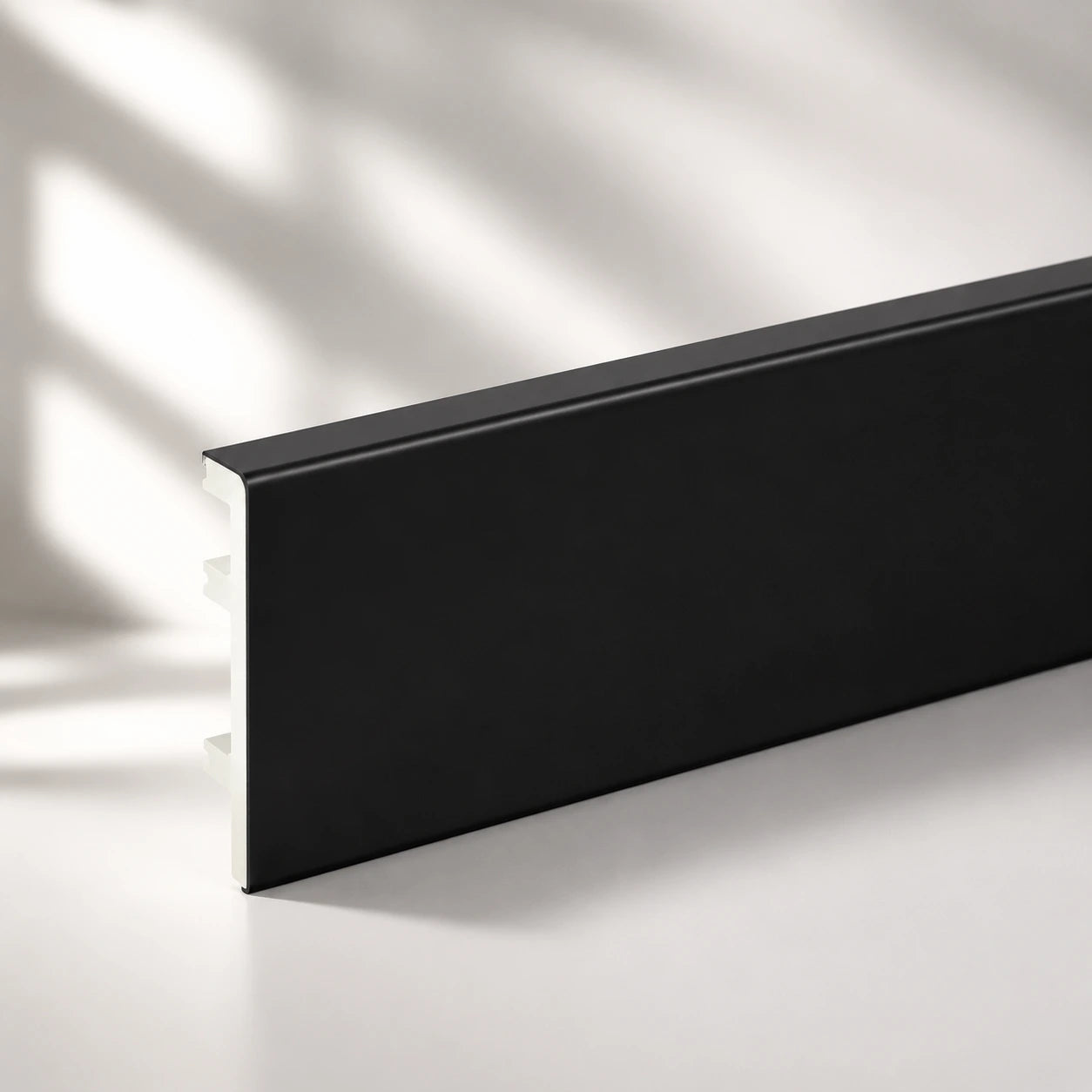 Black PVC skirting board modern interior wall floor junction UK