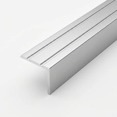 Silver brushed aluminum stair nosing profile with anti-slip grooves, shown in close-up on a white background.